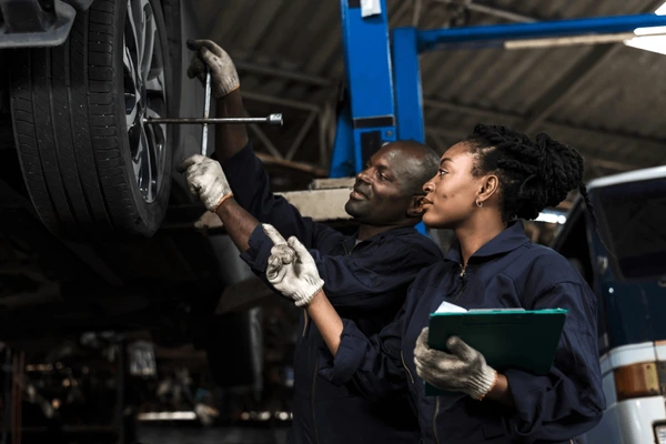 black car mechanic man woman 600nw 2306825335